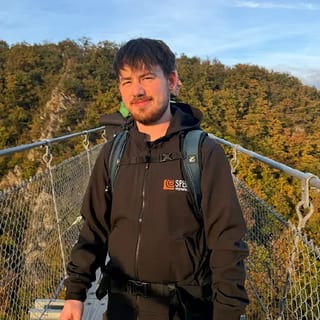 Photo of Danny Schapeit on a suspension bridge